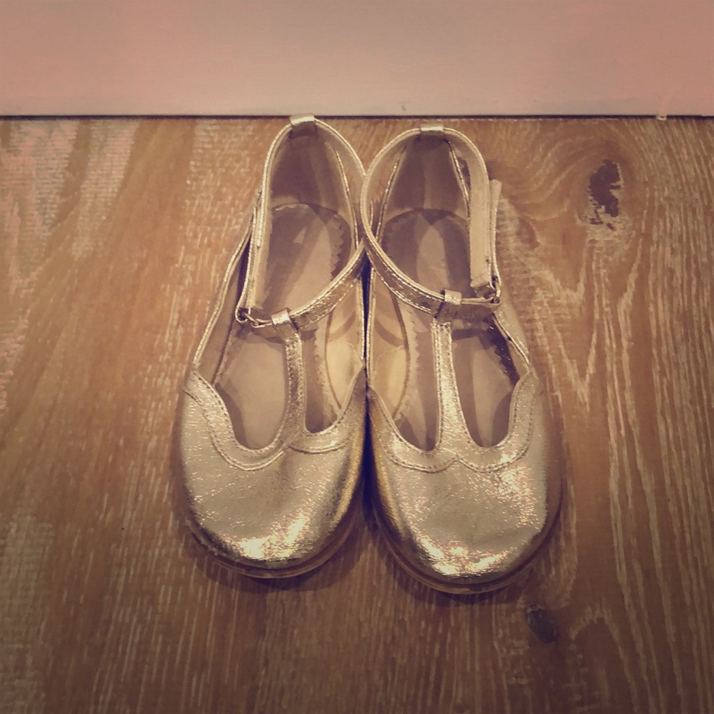 Adorable gold leather T strap shoes from Zara.